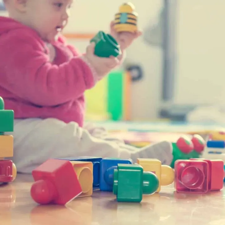 baby playing with blocks at daycare