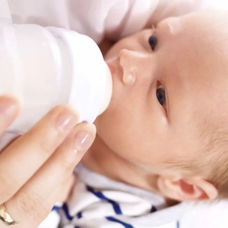 baby drinking milk from a bottle